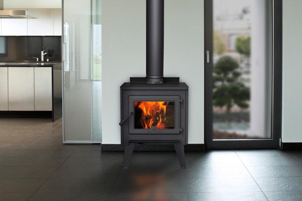 a lit wood-burning stove in a bright modern home